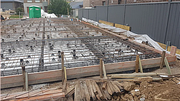 Form work, black plastic, reinforcement steel mesh, reo bar, waffle pods and mesh bar chairs ready for concrete pouring.