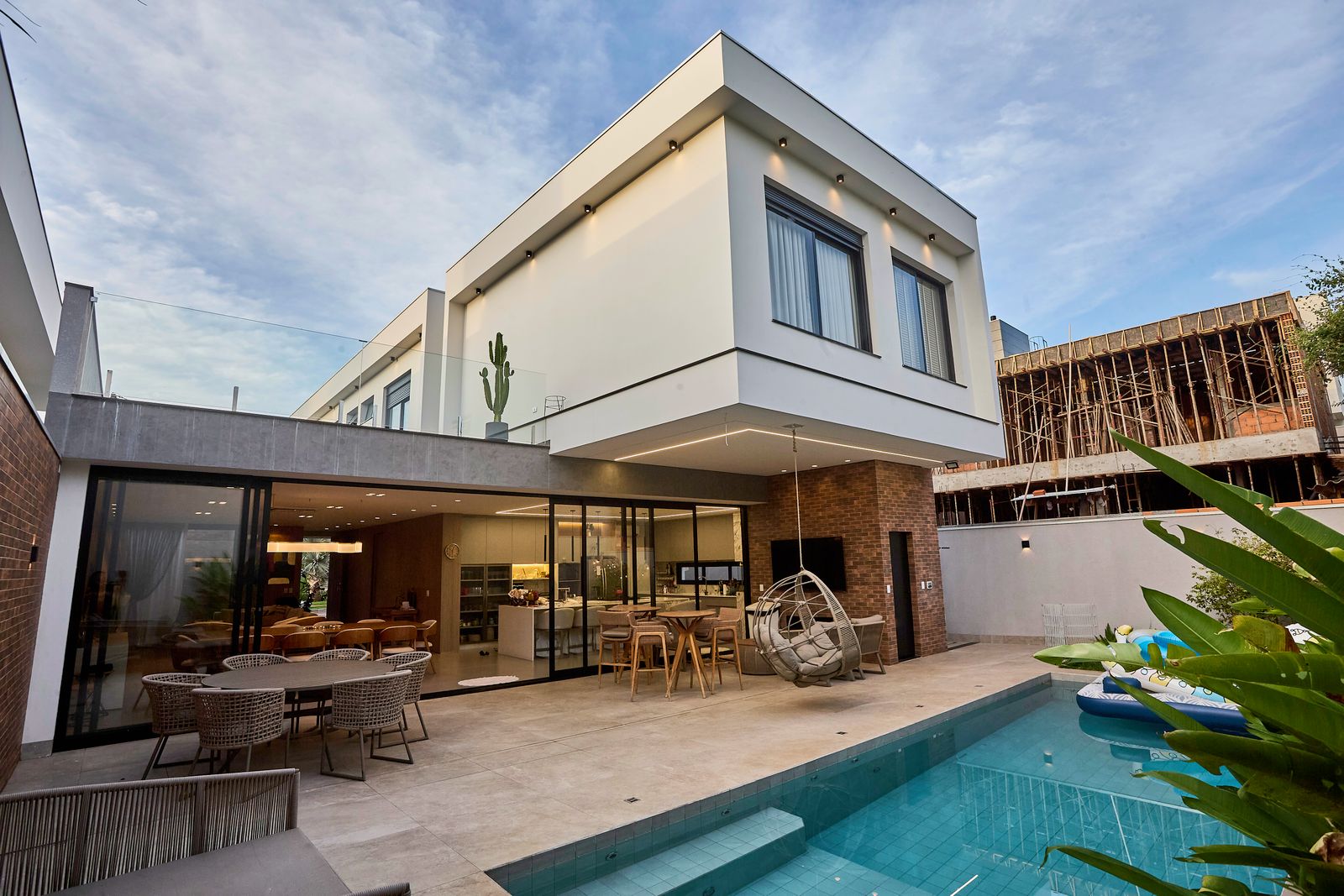 Modern luxury home with pool and landscaped outdoor area